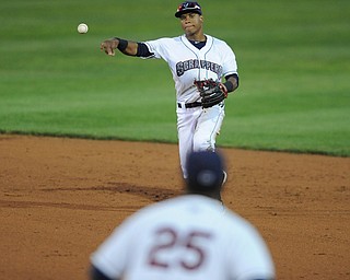 Scrappers second basemen #12 Claudio Bautista throws the ball to first basemen #25 Nellie Rodriguez for the out. 