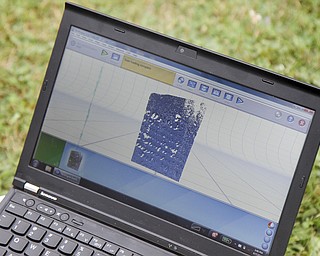 MADELYN P. HASTINGS | THE VINDICATOR
Shown are the results of a 3-D scan of the eroded tombstone of George Foulkes. Matt O’Mansky is using the scanner to try to make out the words on the tombstone in the Glenview Cemetery in East Palestine. O'Mansky was contacted by Jerry Ward, who is a descendant of Foulkes. Foulkes was captured by Indians as a young boy in 1780 and remained a captive for 11 years before escaping.