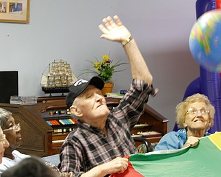 ROBERT K. YOSAY | THE VINDICATOR
Joe Bartos swats at the beach ball as Juanita Burg looks on---y Senior Independence Adult Day Care 1393 Boardman Canfield Rd is the new digs for the people who used to be clients at the Mahoning County Adult Day Care Program.