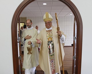 ROBERT K. YOSAY | THE VINDICATOR
Bishop Murry and Deacon John Ettinger bless the entrance
St Dominic's New Parish Center was officially opened today on Southern Blvd. It coincided with the 90th birthday of the church and presided over by Bishop george Murry
