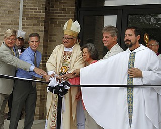 ROBERT K. YOSAY | THE VINDICATOR
Everyone had a hand in the blessing as Chris Enart Parish council treasurer Joe Kiraly Architect for the new parish center - Bishop George Murry - Lori Neill parish president Mike Gentile - Murphy construction and Father Greg Maturi
George MurrySt Dominic's New Parish Center was officially opened today on Southern Blvd. It coincided with the 90th birthday of the church and presided over by Bishop george Murry