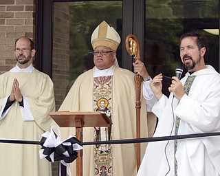 ROBERT K. YOSAY | THE VINDICATOR
Deacon John Ettinger Bishop Murry and Father Greg Maturi at the opening and blessing of the new hall
St Dominic's New Parish Center was officially opened today on Southern Blvd. It coincided with the 90th birthday of the church and presided over by Bishop george Murry