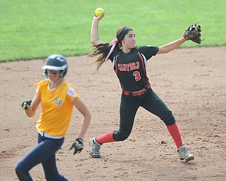 Canfield infielder #3 Mia Kindinis throws the ball to first base for the third out in the top of the 7th inning Michigan base runner #18 Rachel Pijaszek. 