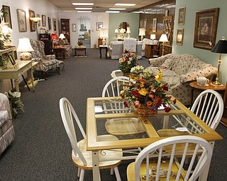 ROBERT K. YOSAY | THE VINDICATOR..the furniture room..Larry and Ann Canale have been running an antiques business for more than five years. Their operation started from a small house in Columbiana, but has since expanded to a storefront there with 6,000 square feet. A feature on their business and how theyÕve managed to grow.--AnnÕs Attic Antiques & Furniture, Columbiana.... - -30-..