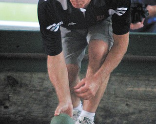 Paul Sauline of Struthers was among many participants playing bocce at Warren’s Italian-American Heritage Festival. The game came from ancient Rome and the tournament can draw a couple of hundred people. The fest runs through Sunday.