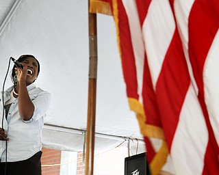 MADELYN P. HASTINGS | THE VINDICATOR..Joselyn Parker of Youngstown sings the national anthem during the Community Cup opening ceremonies at the Central YMCA in downtown Youngstown on Friday, August 9, 2013.. ... - -30-..