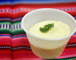 MADELYN P. HASTINGS | THE VINDICATOR..A dish of passionfruit mousse is one of the many varieties of International Latino foods served at the 2nd Annual International Latino Food Fest at the OCCHA Social Hall in Youngstown on Friday, August 9, 2013. ... - -30-..