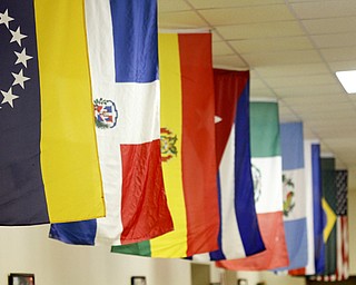 MADELYN P. HASTINGS | THE VINDICATOR..Lined along the ceiling are flags to represent Colombia, Cuba, Dominican Republic, Mexico, Peru, and Puerto Rico at the 2nd Annual International Latino Food Fest at the OCCHA Social Hall in Youngstown on Friday, August 9, 2013. ... - -30-..