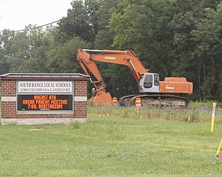 ROBERT K. YOSAY | THE VINDICATOR..Work has begun on the tunnel for South Range Students to travel under St Rt 46 which will be shut down for several weeks as it is intstalled.- The plan is to have install turn lanes too-- ODOT says - SR 46 between Cook Rd. and W. Middletown Rd. is closed through late August for a culvert replacement. The detour is SR 11 to US 224. This work is the beginning of a $750,000 project to add turn lanes and a pedestrian tunnel at SR 46 at South Range School District. The entire project is scheduled to be completed by late October 2013.. . ... - -30-..