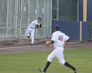 Scrappers left fielder #7 Josh McAdams throws the ball into short stop #48 James Roberts after a Hudson Valley double in the top of the 5th inning on August 9, 2013.