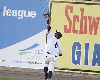 Scrappers outfielder #6 Joel Mejia sticks his glove up to catch a deep fly ball hit to the outfield in the top of the 5th inning, he would make the catch on August 9, 2013.