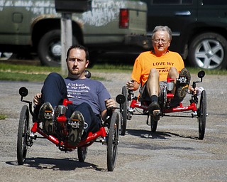 MADELYN P. HASTINGS | THE VINDICATOR..(L-R) Travis and Wayne Wallace take a ride in two of their adult tricycles outside of their store in Lisbon, Rail to Trail. The store in No. 1 in the world for sales of the Catrike tricycles. .... - -30-..