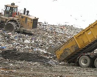 ROBERT K. YOSAY | THE VINDICATOR..mud from a drilling ste is dumped into the landfill to mbe mixed with the garbage and fill..Mike Heher, landfill manager-.. tanker trucks dumping the oil and gas drilling mud into the landfill. .. Because of the local drilling boom, landfill expect a drilling waste dumping bonanza here soon. This landfill can take rock waste from drill cuttings and drilling mud, but not brine or radioactive waste.... - -30-..