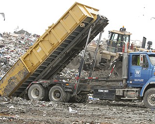 ROBERT K. YOSAY | THE VINDICATOR..mud from a drilling ste is dumped into the landfill to mbe mixed with the garbage and fill..Mike Heher, landfill manager-.. tanker trucks dumping the oil and gas drilling mud into the landfill. .. Because of the local drilling boom, landfill expect a drilling waste dumping bonanza here soon. This landfill can take rock waste from drill cuttings and drilling mud, but not brine or radioactive waste.... - -30-..