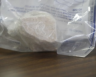 ROBERT K. YOSAY | THE VINDICATOR..a block of heroin is at the YPD ... worth over 9000 dollars .. - -30-..