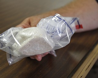 ROBERT K. YOSAY | THE VINDICATOR..a block of heroin is at the YPD ... worth over 9000 dollars .. - -30-..