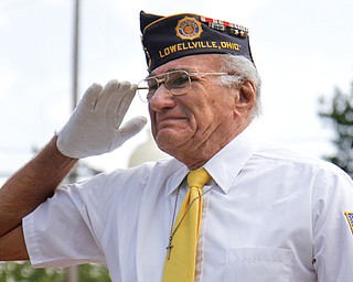 MADELYN P. HASTINGS | THE VINDICATOR..Vince Bellanca of Lowellville sheds a tear while he salutes to a fallen soldier and friend, PFC. Michael Marzetti, who died on November 5, 1944 in Lentrey, France. Bellanca says, "We did everything together" through tears as he shares his respect for his friend during the rededication of the 17 plaques honoring local veterans who died in combat during World War II and the Vietnam War. The dedication was part of Lowellville Day on Saturday, August 10, 2013 in downtown Lowellville. ... - -30-..