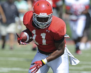 Youngstown State receiver #11 Kevin Watts turns upfield to run for extra yardage after a catch during a scrimmage on August 10, 2013.