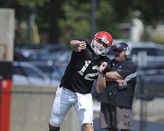 Youngstown State running back #12 Kurt Hess throws a pass from the pocket during a scrimmage on August 10, 2013.