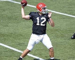 Youngstown State running back #12 Kurt Hess throws a pass from the pocket during a scrimmage on August 10, 2013.