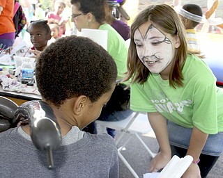 Madison Puckett (10,right) of East Palestine talks to Da'Wan Williams (7) of Youngstown about different styles of face paintings he could get done during the Goodness Invasion at the Covlli Centre on Saturday Morning. Dustin Livesay | The Vindicator 8/10/13 Covelli Centre.