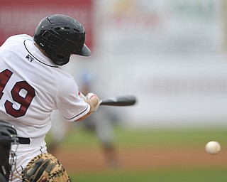 Scrappers bater #49 Cody Ferrell makes contact with a pitch for a hit during a game between the Scrappers and Renegades on August 10, 2013.