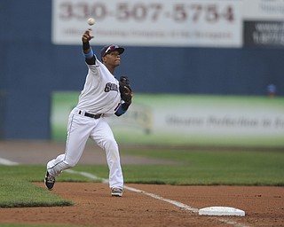 Scrappers third basemen #12 Claudio Bautista throws the ball to first base for the third out in the top of the third inning during a game between the Scrappers and Renegades on August 10, 2013.