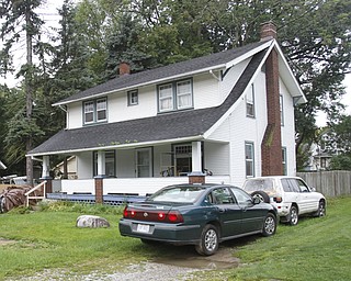 ROBERT K. YOSAY | THE VINDICATOR
Fellows Riverside Gardens is expanding through a grant and recently bought a house at 123 McKinley Ave, Youngstown, OH (white house) They are also expanding the Family Gardens