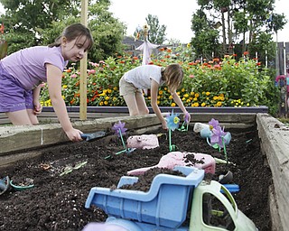 ROBERT K. YOSAY | THE VINDICATOR
THe Family Garden Expansion at Fellows Riverside Gardens..playing in the 'dig area' of the family area is Addison 7 and Taylor 10.5f Bycroft and both of East Palestine