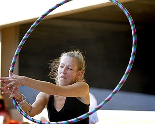 MADELYN P. HASTINGS | THE VINDICATOR
Brenda Lewis of Austintown spins a hula hoop at Vexfest 9 in downtown Youngstown on Sunday, August 11, 2013.