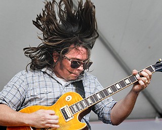 MADELYN P. HASTINGS | THE VINDICATOR
Trevor Harlot plays the guitar in the band Scarlet & the Harlots from Kent, Ohio at Vexfest 9 in downtown Youngstown on Sunday, August 11, 2013.