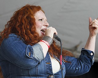 MADELYN P. HASTINGS | THE VINDICATOR
Susan Fletcher sings in the band Scarlet & the Harlots from Kent, Ohio at Vexfest 9 in downtown Youngstown on Sunday, August 11, 2013.