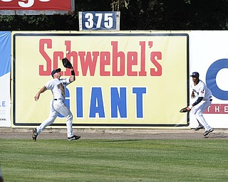 Scrappers center fielder #49 Cody Ferrell prepares to catch a flyable for the 1st out int he top of the 3rd inning during a game between the Scrappers and Renegades on August 1, 2013. Right fielder #6 Joel Mejia pictured.