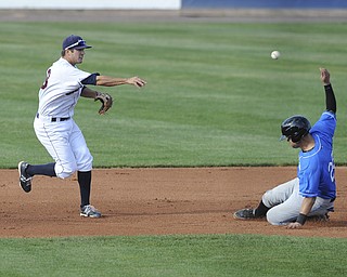 Scrappers infielder #48 James Roberts throws the ball to first base to turn the inning ending double play in the top of the 4th inning after stepping on second base to force out Renegades base runner #28 Oscar Hernandez during a game between the Scrappers and Renegades on August 1, 2013.