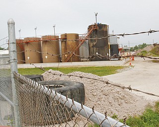 An old pile of tires and a chain-link fence block the entrance to the site of the Northstar 1 injection well in
Youngstown, where storage tanks have started to rust. Its idleness has prompted 4th Ward Youngstown City
Councilman Mike Ray to ask state officials about what is being planned at the site.