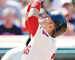 The Indians’ Nick Swisher celebrates his two-run home run off Los Angeles Angels starting pitcher Jerome Williams in the sixth inning of Sunday’s game in Cleveland. The Indians edged the Angels, 6-5, to avoid the sweep.