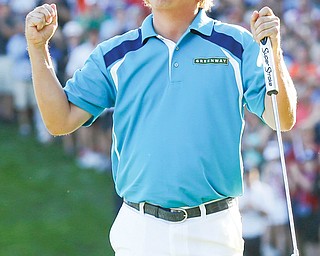 Jason Dufner celebrates winning the PGA Championship on Sunday at Oak Hill Country Club in Pittsford, N.Y. It was the first major win for Dufner, a Cleveland native.