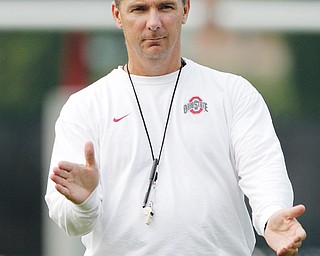 Ohio State football coach Urban Meyer watches his team run drills during practice on Aug. 7 in Columbus. The Buckeyes have nine practices in the next six days.