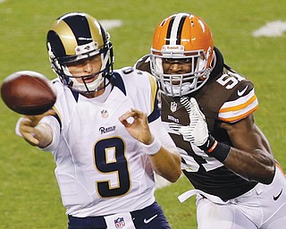 St. Louis Rams quarterback Austin Davis (9) gets rid of the ball as he is chased by Cleveland Browns linebacker Barkevious Mingo (51) in the third quarter of a preseason game on Thursday. Mingo was a force in his NFL debut as the Browns beat the Rams, 27-19.