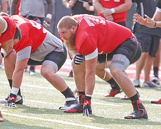Youngstown State offensive lineman Andrew Sinko lines up during practice Tuesday at Stambaugh Stadium.
Sinko, a Strongsville native, appeared in all 11 games for the Penguins last season.