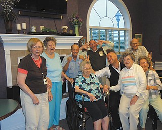 SPECIAL TO THE VINDICATOR
Whispering Pines residents of Columbiana enjoyed music and fun with Christopher Milo Aug. 2, hosted by Crossroads Hospice. In attendance, from left, were Rosemary Magee, Ferne Oliver, Bob Buerkle, Chaplain Dan Tayman and Ernie Bernard. Seated are Ruth Wagenhouser, Milo, Lois Lawrence and Pernie Wukotich.