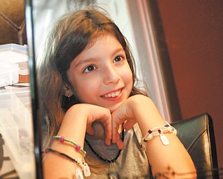 Talia Vale Mollica, the 9-year-old daughter of Kristen and Dominic Mollica of Canfield, recently started her own business, Bling Dazzles, to sell the jewelry she designs. Each piece is unique, and comes with a name and a story that explains her inspiration. Talia has made about 300 one-of-a-kind pieces.