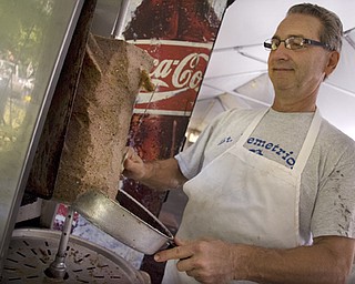 Kelli Cardinal/The Vindicator
Greg Giannios, from Boardman, shaves gyro meat Saturday during a traditional Greek Festival at St. John's Greek Orthodox Church on Glenwood Avenue in Boardman.  The festival offers many Greek style foods including, lamb sandwiches and stuffed grape leaves.