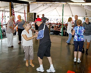 MADELYN P. HASTINGS | THE VINDICATOR

Several couple dance the night away at the Brier Hill Italian Festival, the longest continuously running Italian Fest in the city of Youngstown, on Saturday, August 17, 2013. The event features games, food, table vendors and live music. and runs through Sunday.
