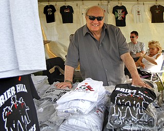 MADELYN P. HASTINGS | THE VINDICATOR

Tony Trolio sells Italian style T-shirts at his booth, Trolio's shirts, at the Brier Hill Italian Festival, the longest continuously running Italian Fest in the city of Youngstown, on Saturday, August 17, 2013. The event features games, food, table vendors and live music. and runs through Sunday.