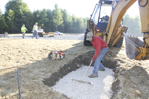 Workers with Miller-Yount Paving of Bazetta, including Curtis Jones  
in the foreground are shown completing parking lot and drainage work  
at the new Eastlake MetroPark being created on state Route 46 just  
north of Lake Vista retirement community in Cortland. The first phase  
of the park will include a sled riding hill to be ready this winter.