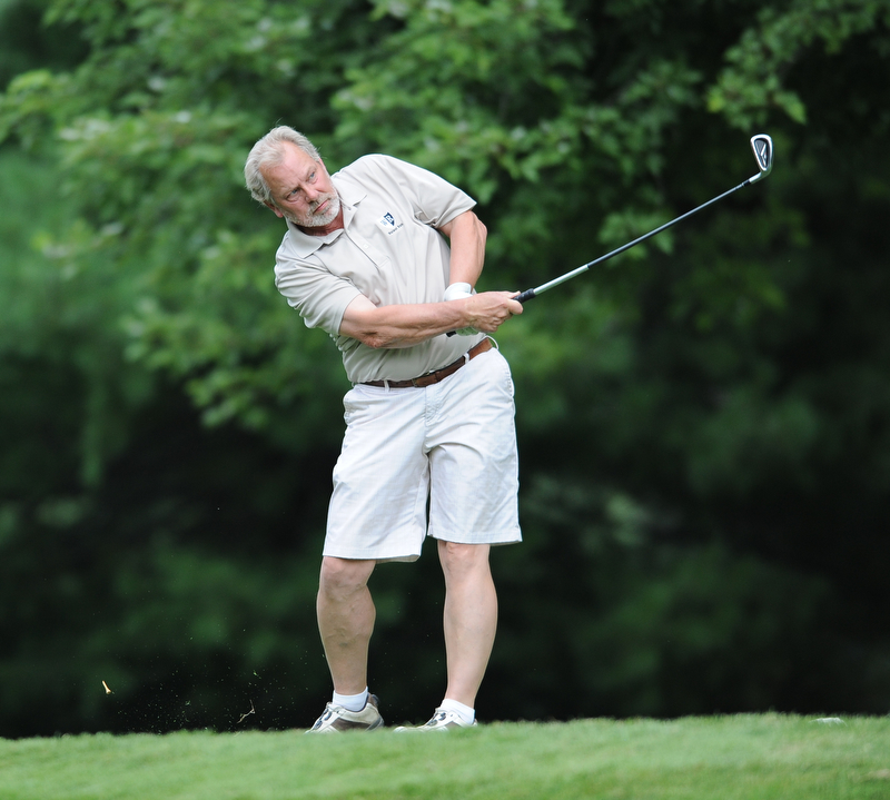 Gary Rouzer of Weathersfield follows through on his tee shot on the 12th hole Tuesday afternoon at the Trumbull Country club.