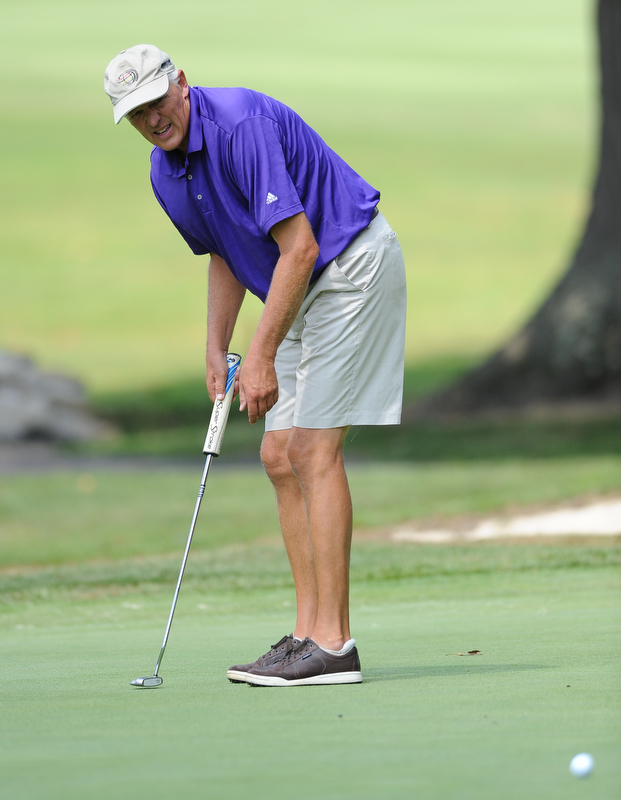 Tom Korner follows through on a putt on the 15th hole Tuesday afternoon at the Trumbull Country club.