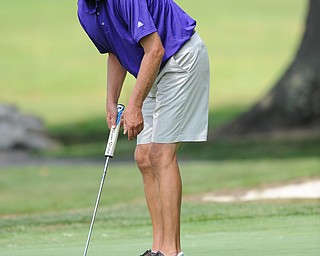 Tom Korner follows through on a putt on the 15th hole Tuesday afternoon at the Trumbull Country club.