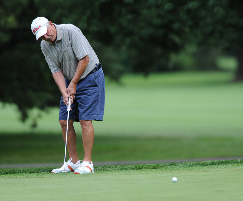 Dan Baoint of Boardman follows through on his putt on the 12th hole Tuesday afternoon at the Trumbull Country club.